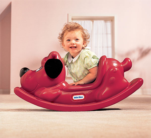 Child playing with Rockin' Red Puppy Rocker